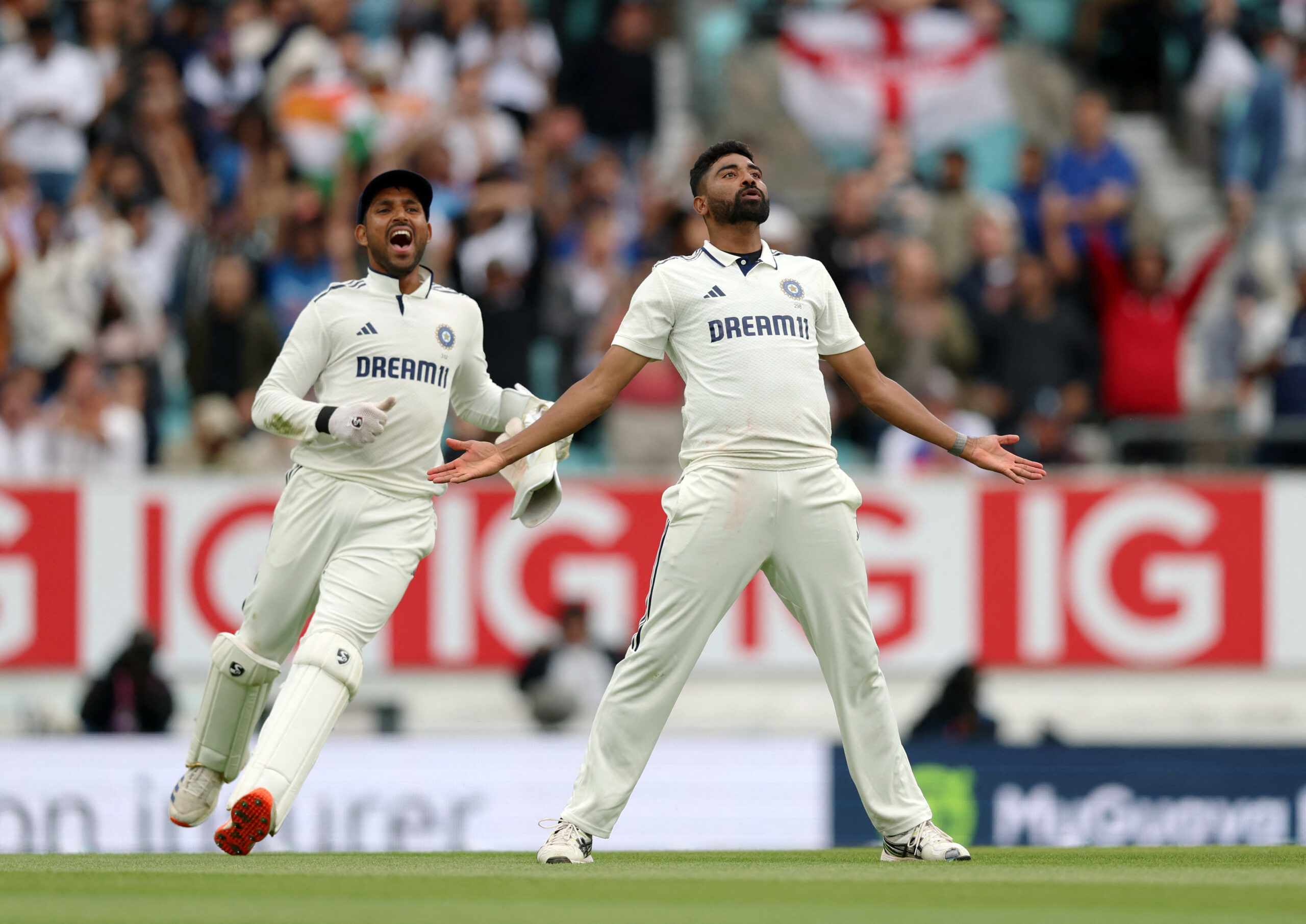 Mohammed Siraj celebrates with Dhruv Jurel after dismissing Gus Atkinson in the final Test against England at The Oval 2025.